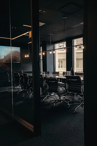The Ownly team in a boardroom conversation